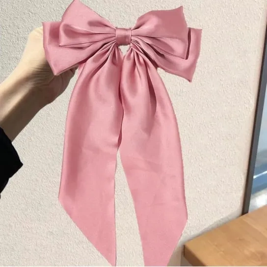 Ozdobna kokarda do włosów na spince różowa